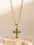 Stainless steel zircon cross pendant necklace with green stones on gold-plated chain.