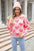 Angel Wings round neck dropped shoulder sweater with heart pattern in pink.