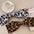 2 Piece Leopard Bow Hair Clip made of polyester, featuring black and brown leopard prints.