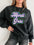 MARDI GRAS round neck drop shoulder sweatshirt in black with embroidered lettering.