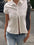 White button-down collared neck short sleeve shirt made of polyester.