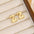 18K Gold-Plated Bubble Letter Stud EarringsMyMooiaTrendsiPieces: 1-pair
Material: 18K gold-plated, Copper
Care instructions: Avoid wearing during exercise, as sweat will react with the jewelry to produce silver chloride an18K Gold-Plated Bubble Letter Stud Earrings