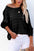 Round neck long sleeve knit top in black, featuring a basic style and slightly stretchy fabric.