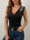 Rhinestone detail surplice tank with V-neck in black, slightly stretchy fabric.