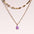 Stainless steel opal pendant necklace with 14K gold-plated chain.