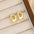 18K Gold-Plated Bubble Letter Stud EarringsMyMooiaTrendsiPieces: 1-pair
Material: 18K gold-plated, Copper
Care instructions: Avoid wearing during exercise, as sweat will react with the jewelry to produce silver chloride an18K Gold-Plated Bubble Letter Stud Earrings