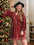 Plus size lace detail V-neck long sleeve mini dress in red, worn by a woman near a Christmas tree.