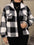 Plus size pocketed plaid collared neck jacket in black and white.