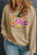 Plus size sweatshirt with colorful pumpkin graphic and dropped shoulders.