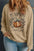 Plus size pumpkin graphic long sleeve sweatshirt with leopard print design.