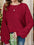 Plus size red round neck batwing sleeve T-shirt with textured fabric.