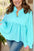 Plus size textured peplum long sleeve blouse in blue.