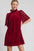 Umgee red velvet dress with dotted lace sleeves and mock neck.