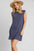 Umgee round neck sleeveless high-low curved hemline mini dress in blue.