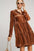 Umgee texture tiered collared long sleeve dress in striped brown fabric.